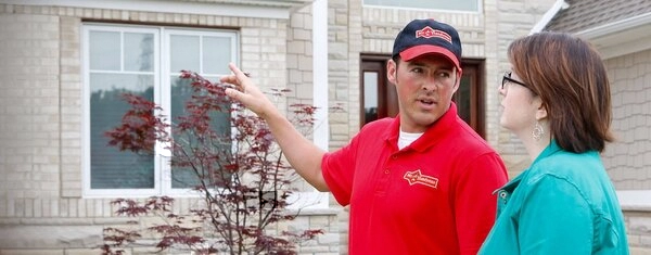 Mr. Handyman technician outside Flower Mound home.