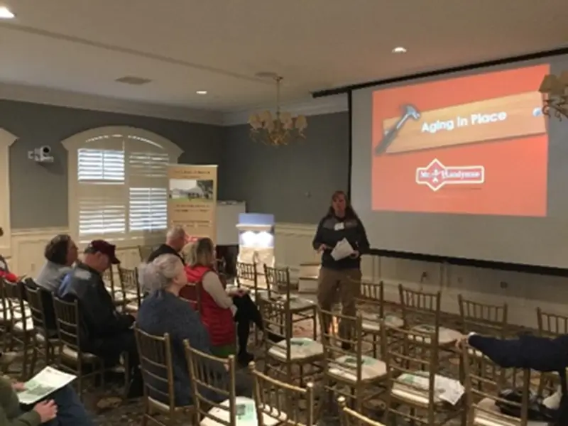 A group of people watching a presentation from Mr. Handyman about aging in place in Northern Virginia.