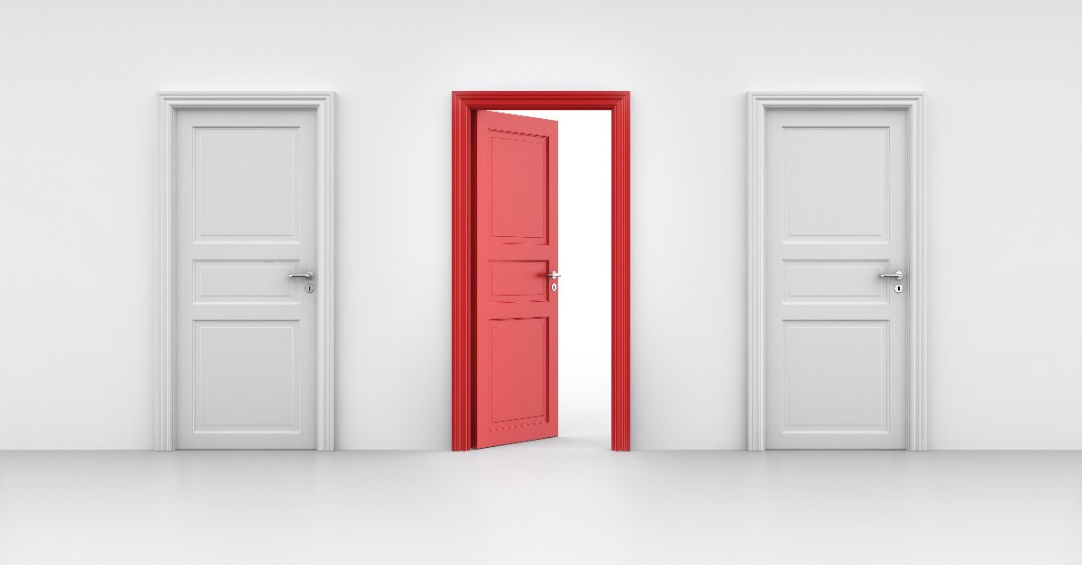 A row of three doors against a white background, with two white doors on each end and an open red door in the middle.