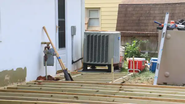 The deck in the midst of being repaired, with new wood slats visible.