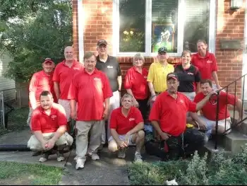 2013 team photo in front of veteran's house for National Day of Service.