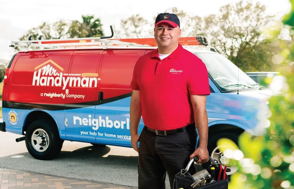 Mr. Handyman tech ready to perform home repairs in one of many service locations.