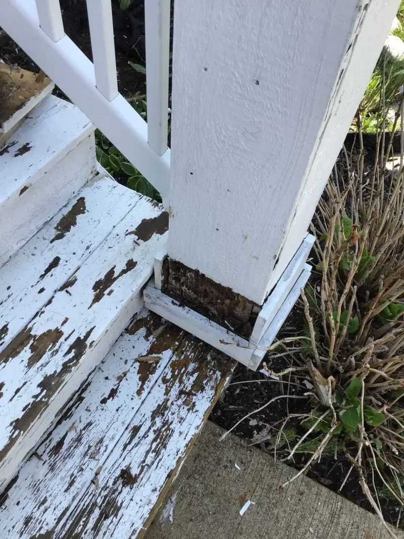 Wood rot on exterior stair post.