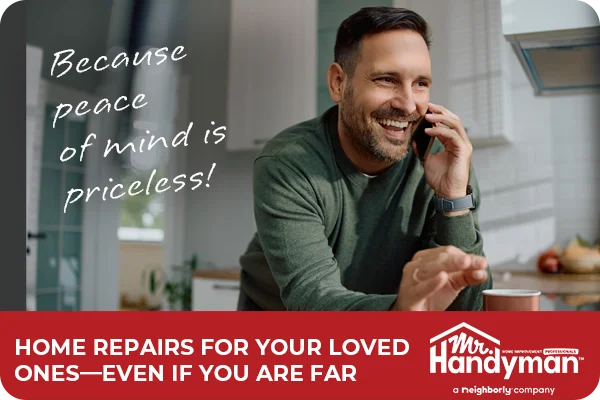 Happy man talking on the phone with his mother after Mr. Handyman finished the repairs in her home.