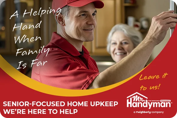 A handyman assists a smiling senior woman.