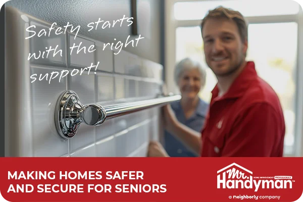 Handyman installs safety grab bars as a senior woman looks on.