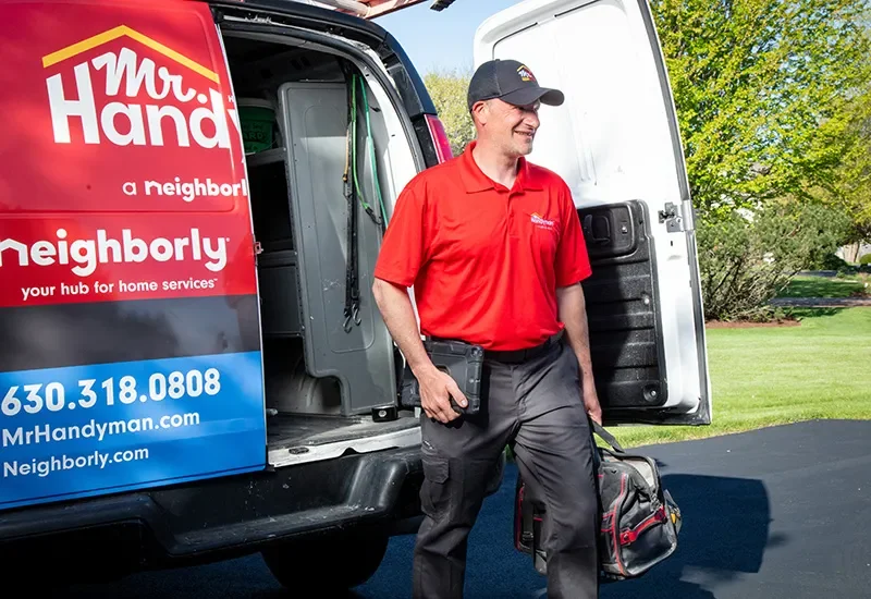 Mr. Handyman repairman arriving to perform cabinet installation & repair