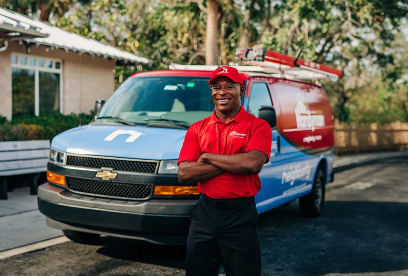 Mr. Handyman tech outside a small business before performing commercial handyman repairs.