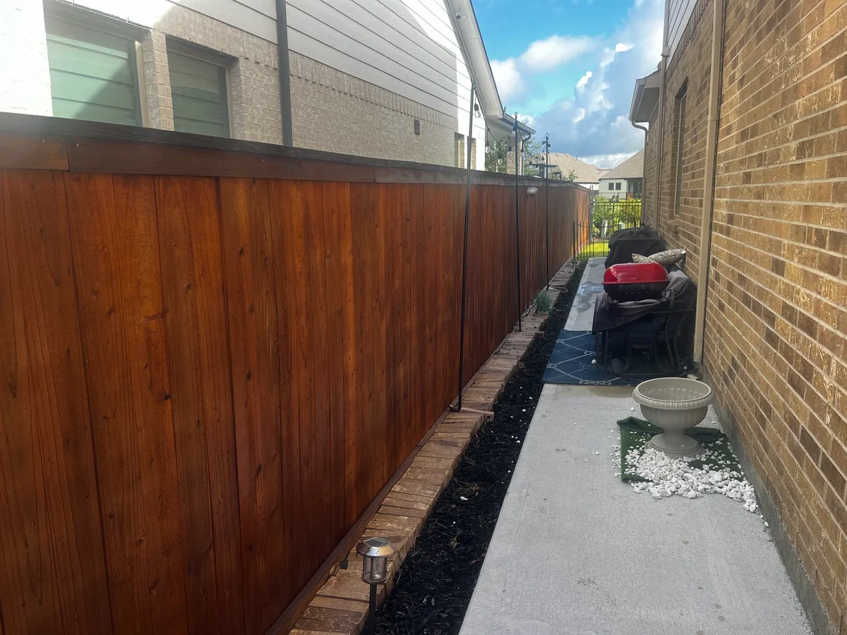 Freshly stained fence after effective Richmond fence repair by Mr. Handyman.