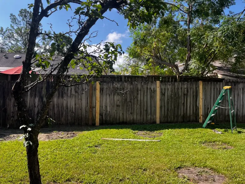 New fence boards installed by Mr. Handyman during fence repair in Richmond, TX.