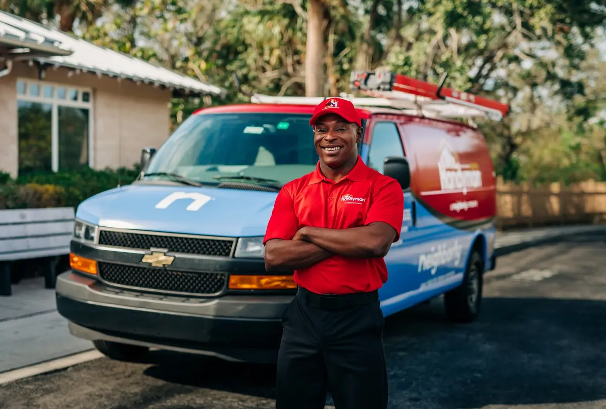 Mr. Handyman technician outside of Manassas home to provide fascia repair services.