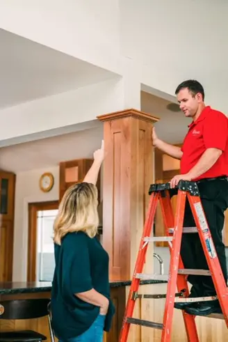 A My Handyman technician discussing custom carpentry work with a client.