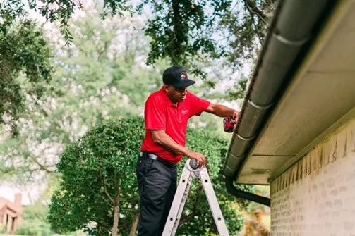 A My Handyman technician repairing a home's soffit and fascia.