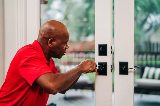 A My Handyman technician repairing a door.